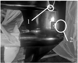 Gear oil drain and fill screw locations on lower casing