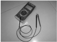 Digital multimeter and peak voltage adapter for trigger coil test