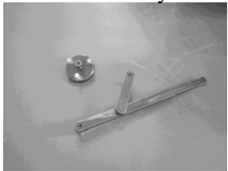 Flywheel gripper and puller assembly for engine disassembly