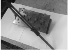 Valve spring compressor in use on cylinder head