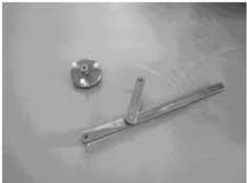 Flywheel gripper and puller for compression test