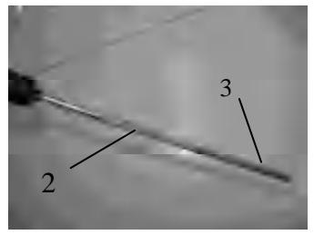 Close-up of oil dipstick guide and level marks