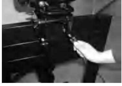 Tightening transom clamp screws on outboard motor