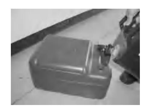 Carefully filling the fuel tank