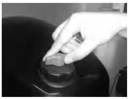 Loosening air vent screw on fuel tank cap