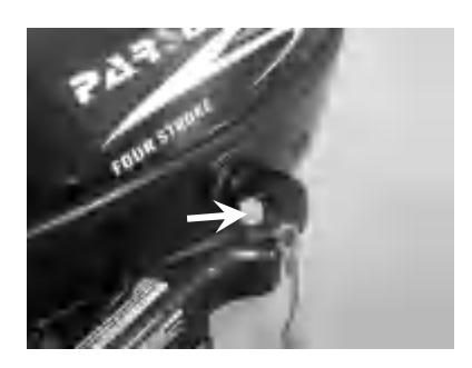 Pushing engine stop button to stop engine