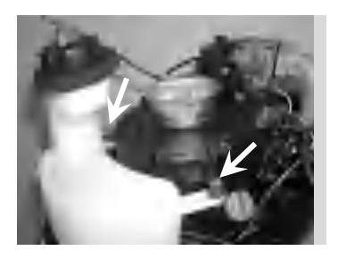 Reinstalling bolts to secure fuel tank