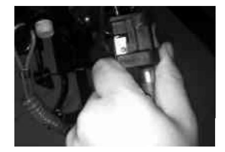 Disconnecting fuel line before tilting