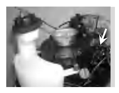 Reinstalling bolts to secure fuel tank