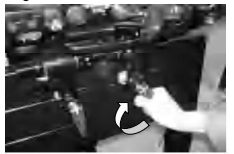 Tightening transom clamp screws on outboard motor