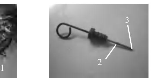 Dipstick showing upper and lower oil level marks